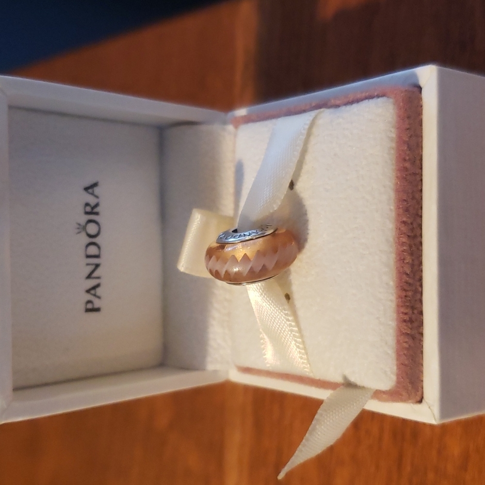 Pandora Murano glass bead.  Pink wavy Ig zag design.